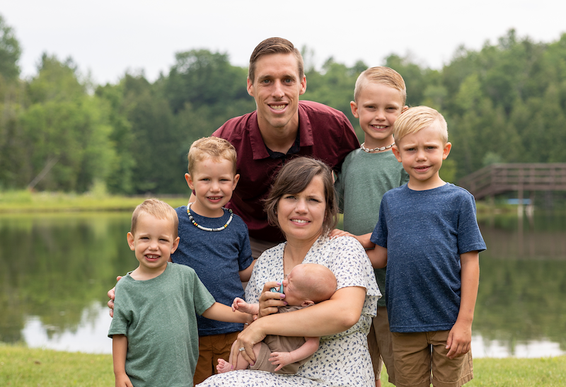 Christian, Megan and their 5 children by the pond
