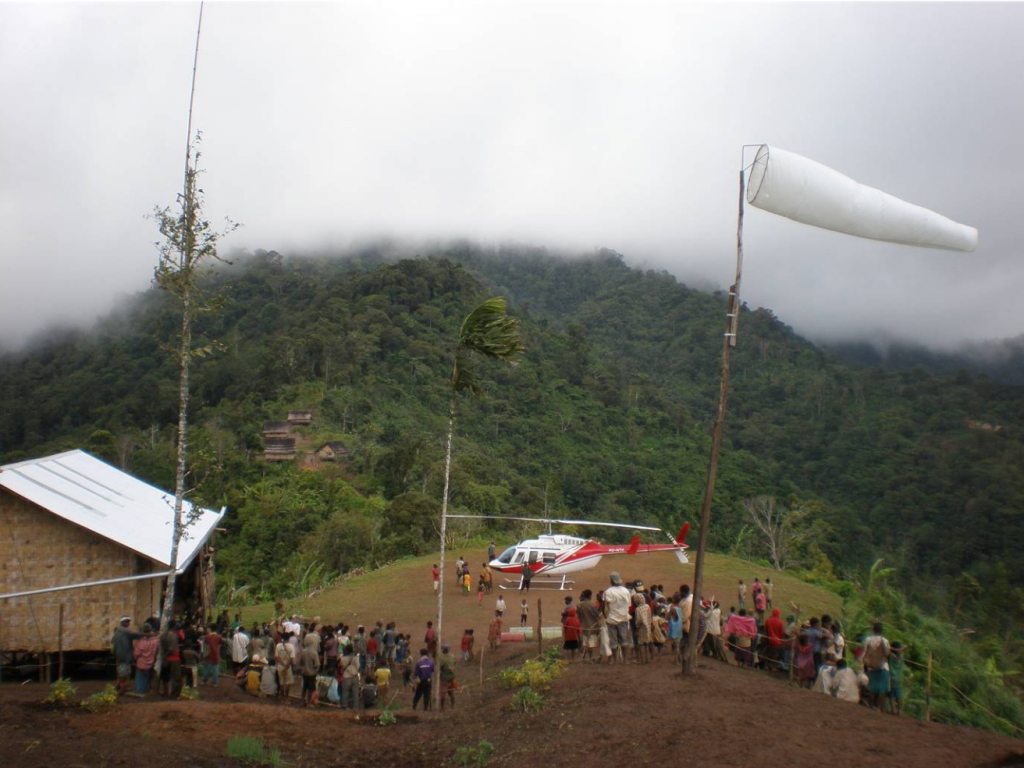 many villagers gather to meet helicopter that's landed