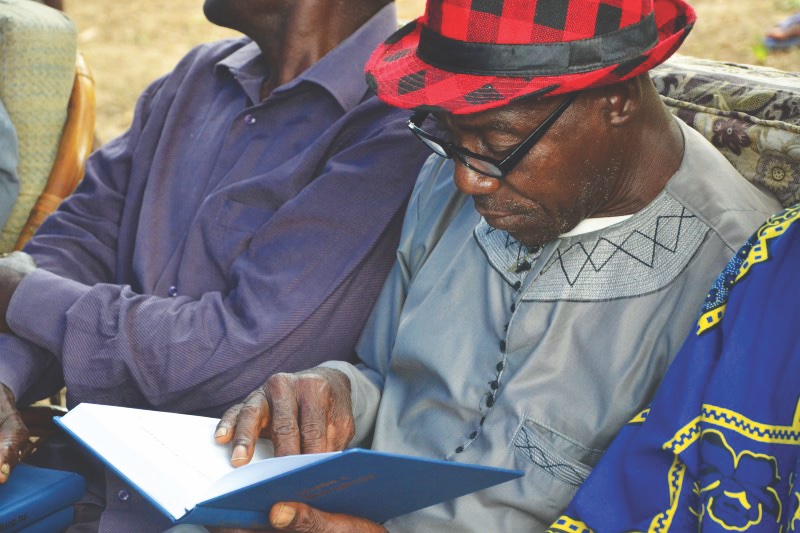 man reading Bible