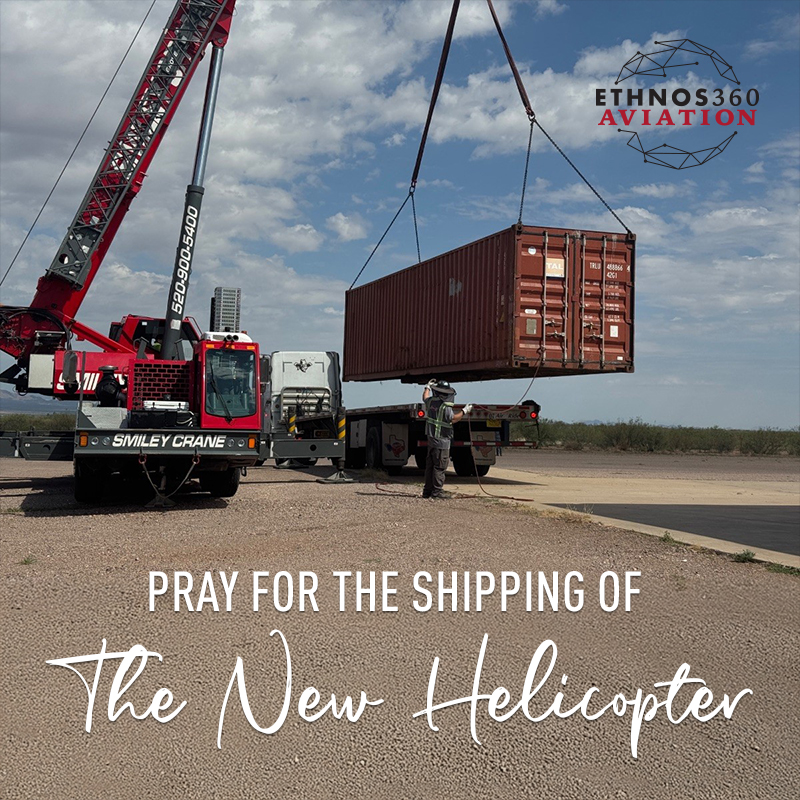 A sea container is used to ship a helicopter overseas